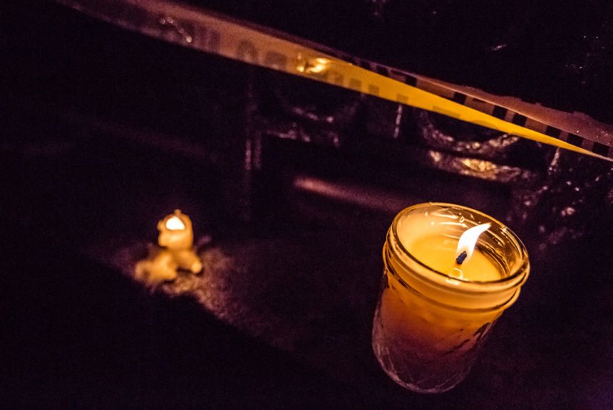 A candle and police tape from the scene where Philando Castile was shot and killed by police sits outside the Minnesota Governor's mansion on July 7, 2016.