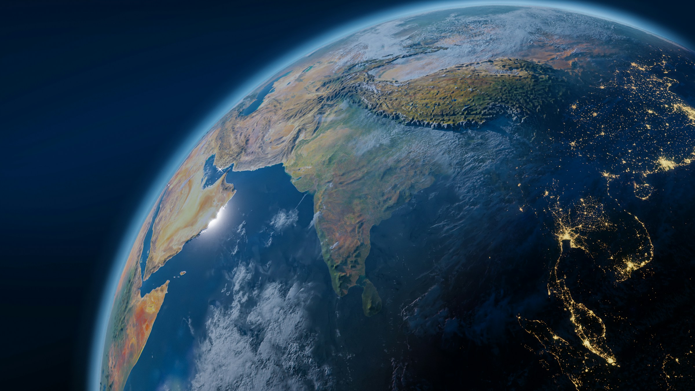 Living Earth Community article image Earth viewed from space at night, with Asia illuminated.